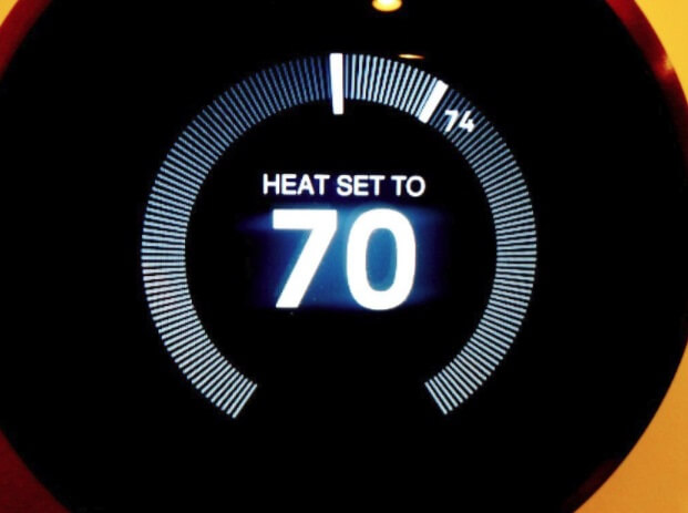 A programmable thermostat set to 70 degrees