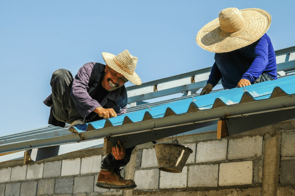 Roofers working on a home