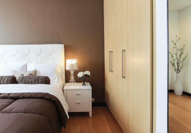 A freshly renovated master bedroom with earth tones